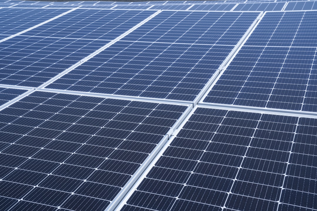 a large array of solar panels on the roof of a building